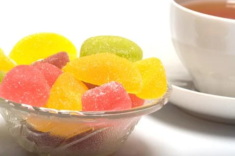 Fruit candy and tea Stock Photos