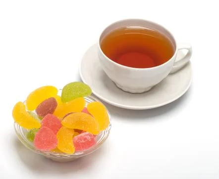 Fruit candy and tea Stock Photos