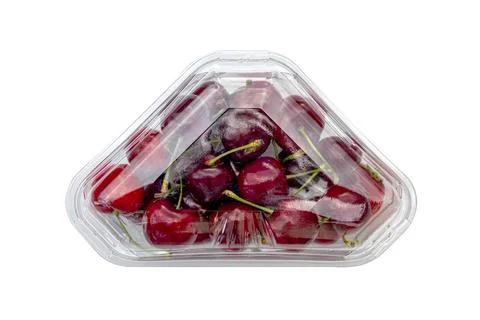 Fruit cherries in plastic box on white background. Stock Photos