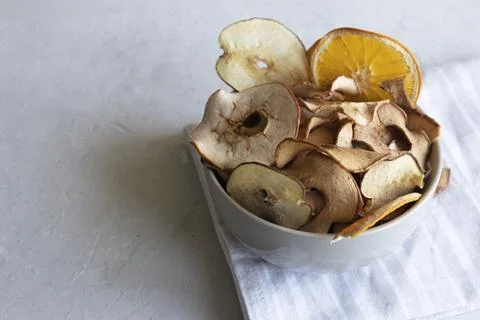 Fruit chips on a striped napkin apple snacks and pear chips Stock Photos