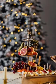 Fruit Christmas tree on table on dark background Stock Photos