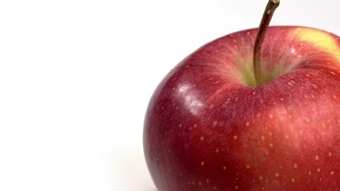 Fruit close whole red apple Spinning and Rotating Isolated on White Background Stock Footage 222998056