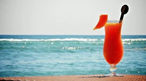 Fruit cocktail on the beach Stock Footage 12238980