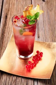 Fruit cocktail drink with pineapple slice garnish Stock Photos