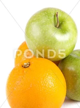 Fruit composition, green apples and oranges Stock Photos