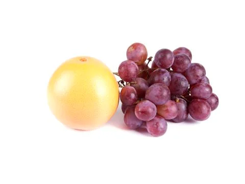 Fruit composition of ripe grapefruit and grapes Stock Photos