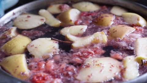 Fruit compote cooking, apples, pears, and berries boil in a pot on the stov.. Stock Footage 310224866