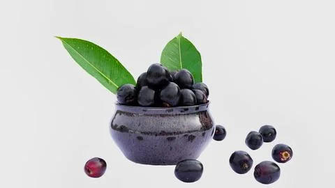 Fruit - Concept image of jamun or jambolan in the pot at the dinner table, .. Stock Photos