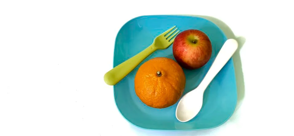 Fruit in a container ( orange apple ) Stock Photos