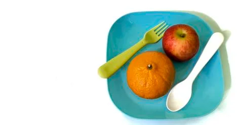Fruit in a container ( orange apple ) Stock Photos