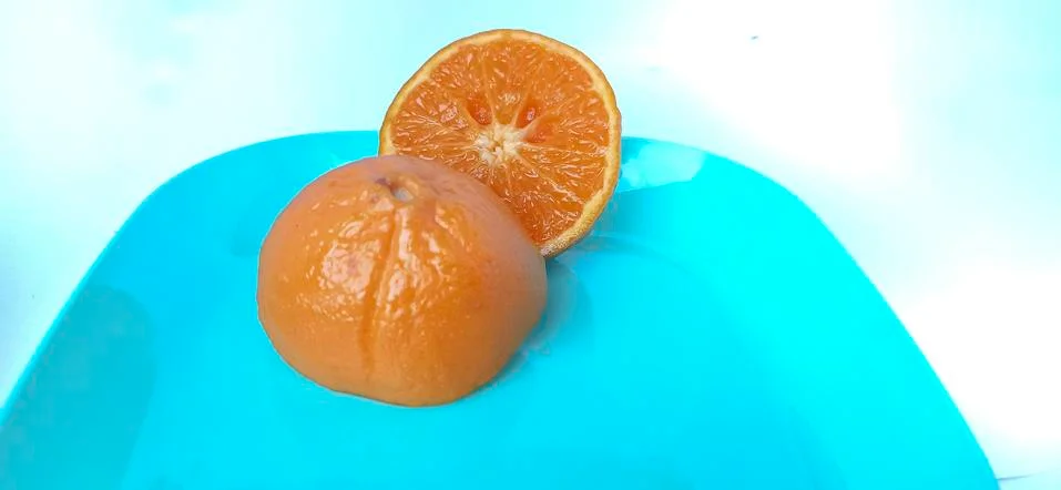 Fruit in a container ( orange ) Stock Photos