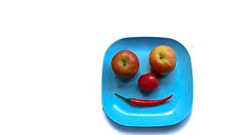 Fruit in a container (  pepper  tomato  apple ) Stock Photos