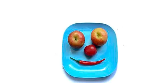 Fruit in a container (  pepper  tomato  apple ) Stock Photos