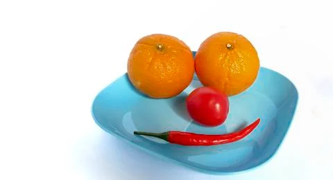 Fruit in a container (  pepper  tomato  orange ) Stock Photos