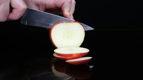 Fruit. Cut an apple into slices Stock Footage 169617009