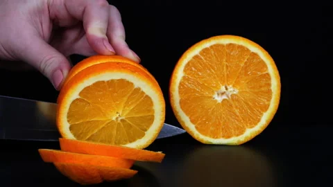 Fruit. Cut orange into slices Stock Footage 169617505