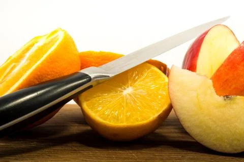 Fruit cutted with knife Stock Photos