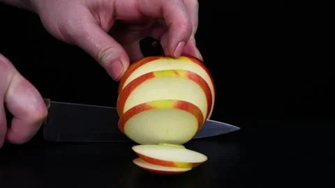 Fruit. Cutting an apple into slices Video stock 169617532