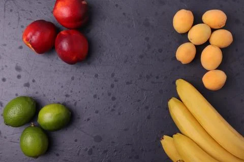 Fruit on dark stone surface Foto stock