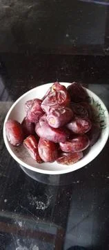 Fruit dates on a plate Stock Photos