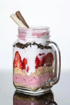Fruit dessert in a jar with reflection Stock Photos