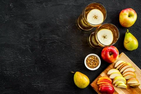 Fruit drinks with apple and pear on black table top-down copy space Stock Photos