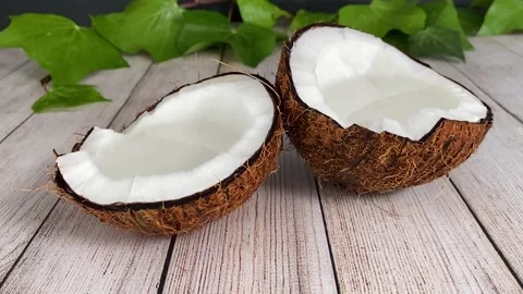 Fruit falling on coconut and splashing in slow motion. Stock Footage 130350530