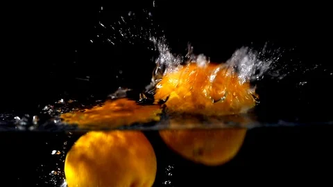 Fruit falling in slow motion against black background - 02 Stock Footage 109541663