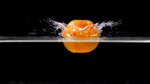 Fruit falling in slow motion against black background - 01 Stock Footage