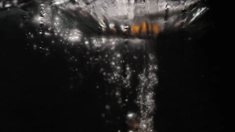 Fruit falling into water in slowmotion Stock Footage 254584742