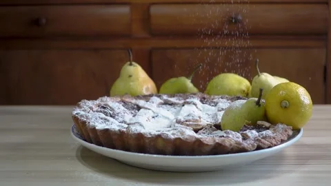 Fruit-filled sweet pie on a ceramic plate. Ripe whole pears and lemons surr.. Stock Footage 275621457