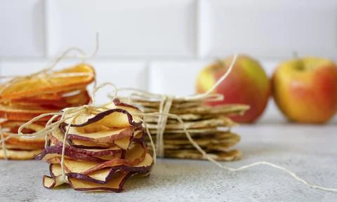 Fruit frips on a light background. Fruit chips. Stock Photos