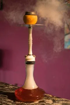 Fruit Hookah stands on the table. Grapefruit hookah. For restaurant menu. Stock-Fotos