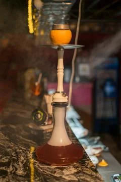 Fruit Hookah stands on the table. Grapefruit hookah. For restaurant menu. Stock Photos