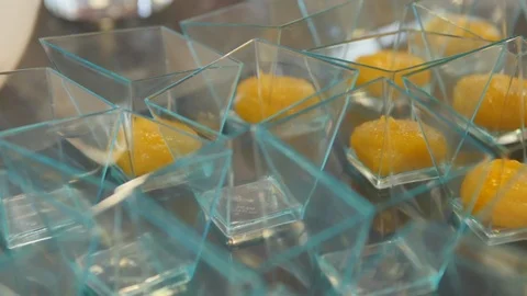 Fruit Jam is Squeezed into Glasses from a Pastry Bag Stock Footage 98149615