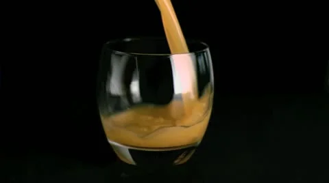 Fruit juice being poured in super slow motion Stock Footage
