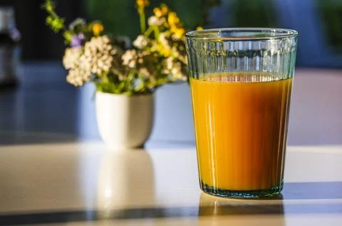 Fruit juice on the breakfast table Stock Photos