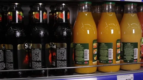 Fruit juice in glass bottles Stock Footage 75256389