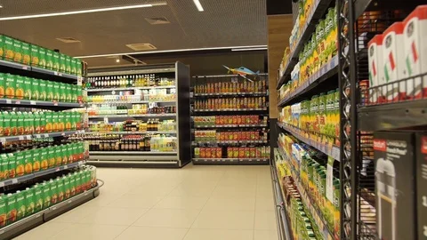 Fruit juice in the package is on the shelves in the store Stock Footage 75255728