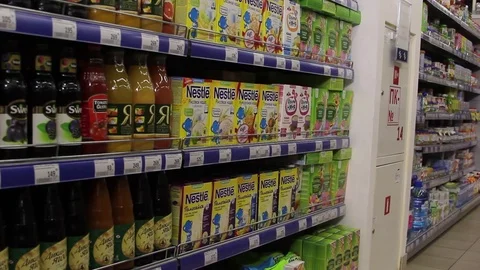 Fruit juices in the package, showcase of fruit juices Stock Footage 75256902