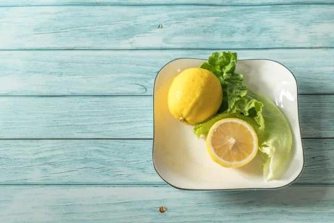 The fruit lemon on the blue table, cool light background Stock Photos
