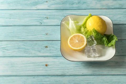 The fruit lemon on the blue table, cool light background Stock Photos