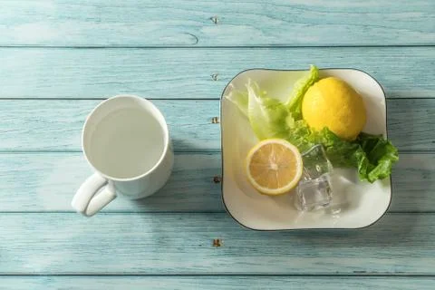 The fruit lemon on the blue table, cool light background Stock Photos