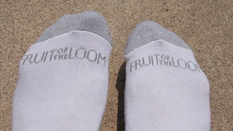 fruit of the loom socks on feet with wor... | Stock Video | Pond5