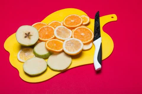 Fruit lying on a cutting board Stock Photos