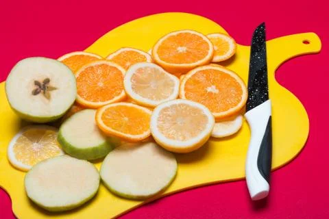Fruit lying on a cutting board Stock Photos