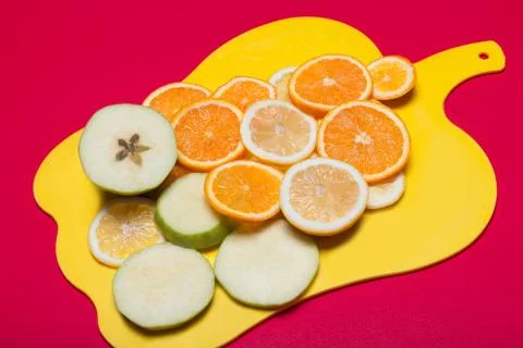 Fruit lying on a cutting board Stock Photos