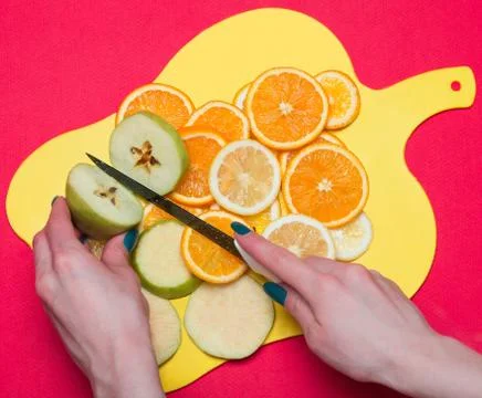 Fruit lying on a cutting board Stock Photos
