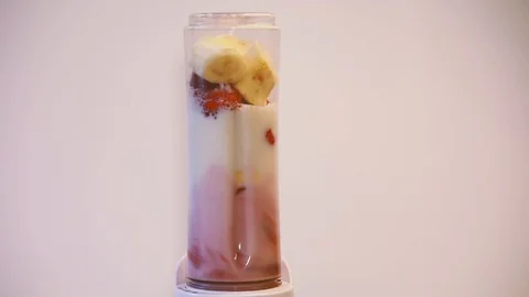Fruit mixing into blender Stock Footage 129451006