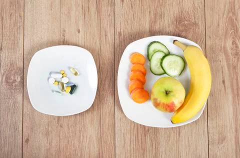 Fruit or pills Stock Photos